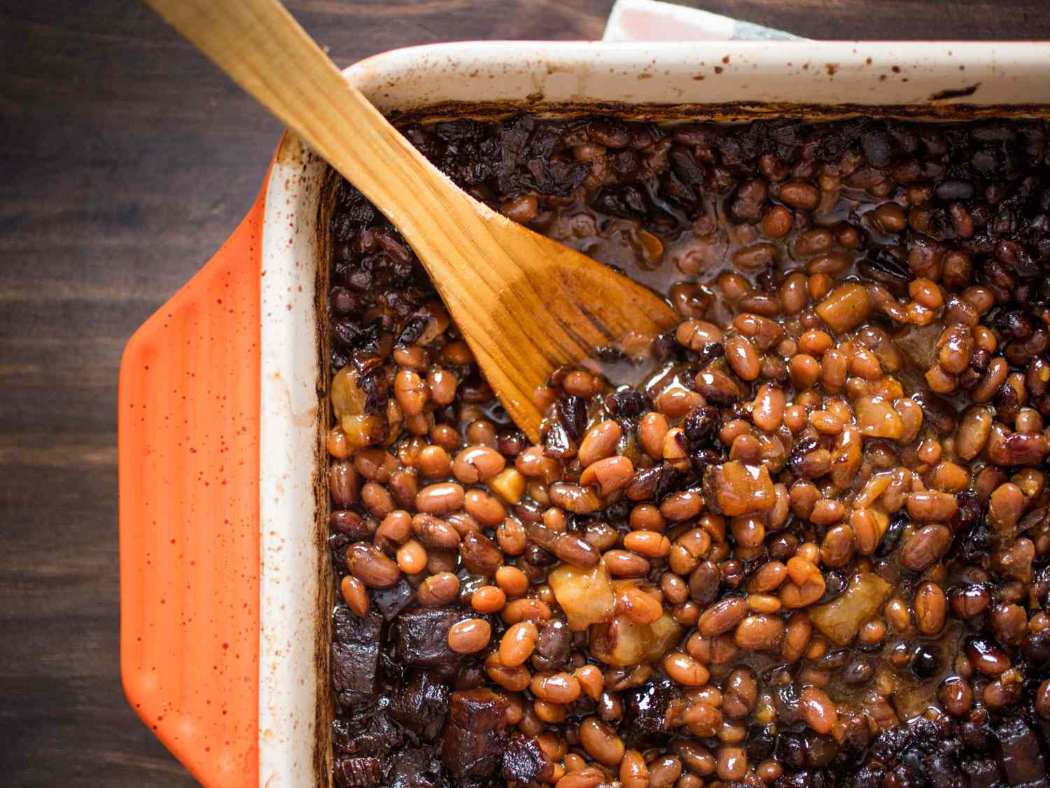 Cooking Boston baked beans in a baking dish.