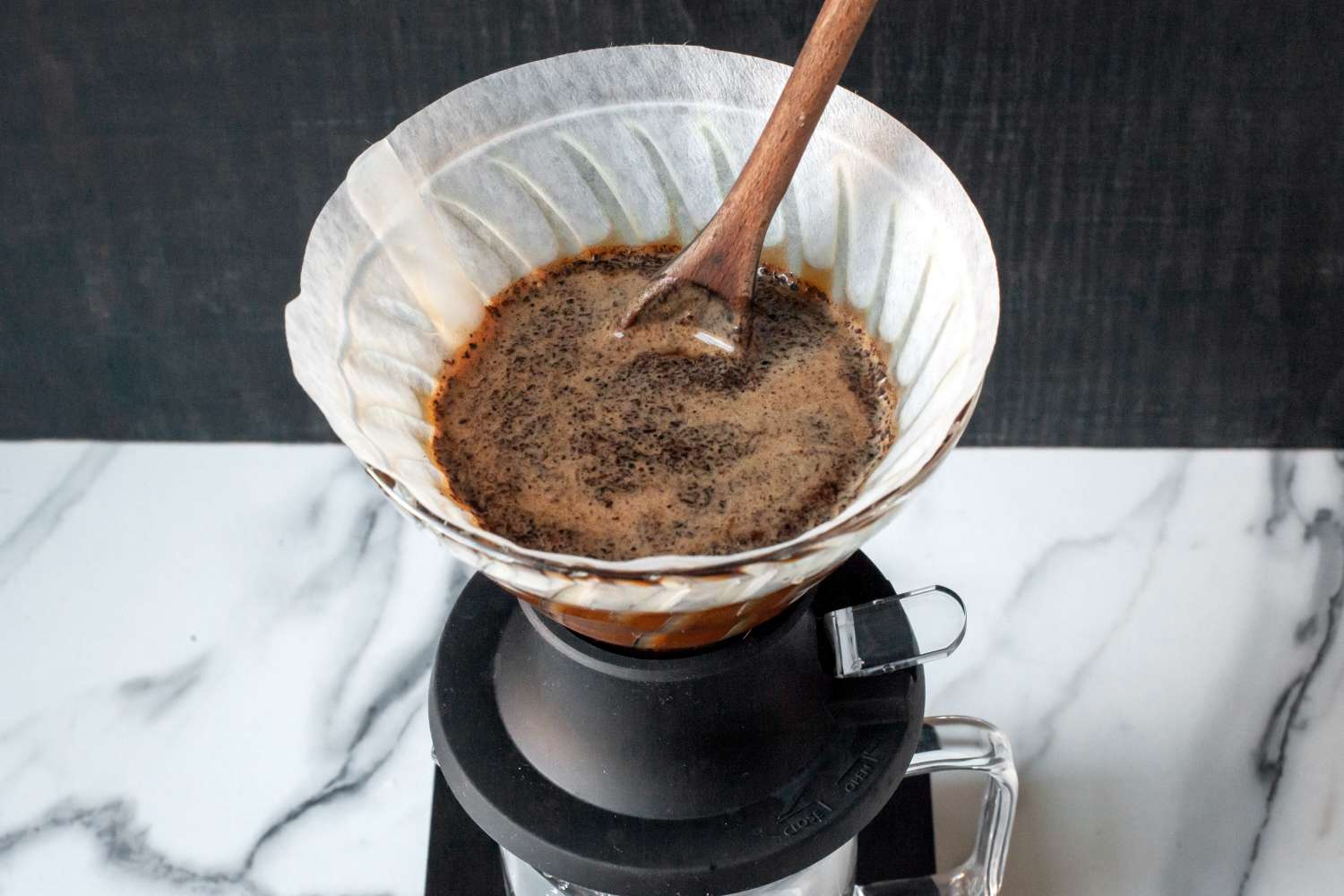 Coffee grounds being stirred in the Hario Switch pour-over dripper