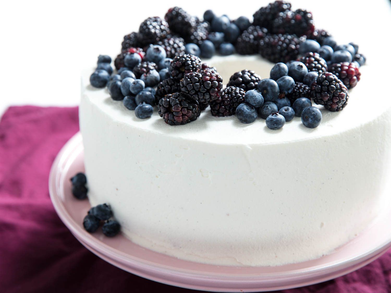 Chiffon cake frosted in chantilly cream, topped with ring of fresh blueberries and blackberries. 