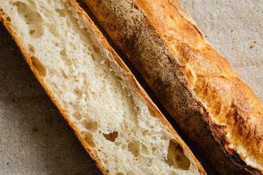 A sliced baguette showing the crust and the texture of the interior