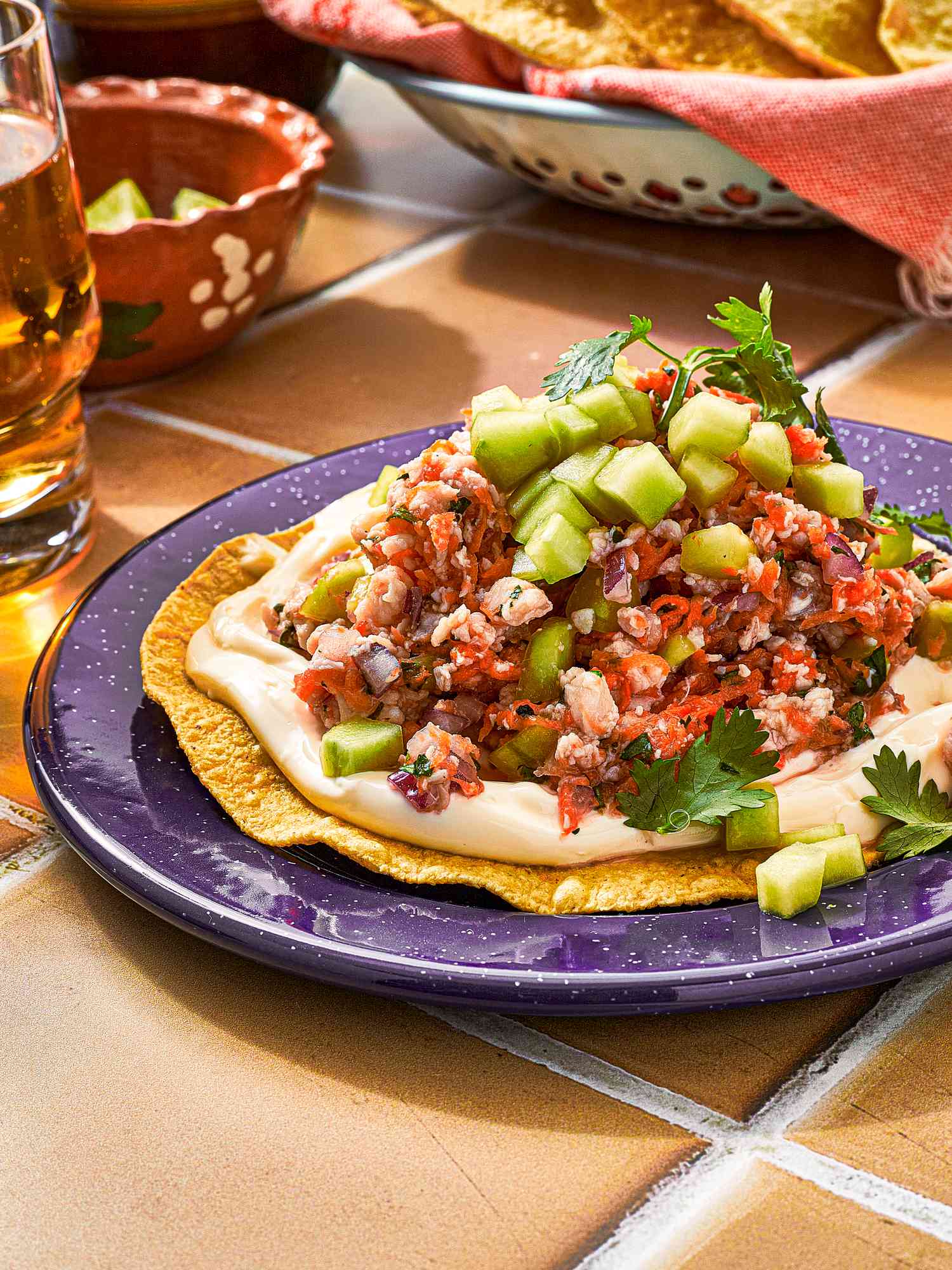Side view of a serving of ceviche on a tostada