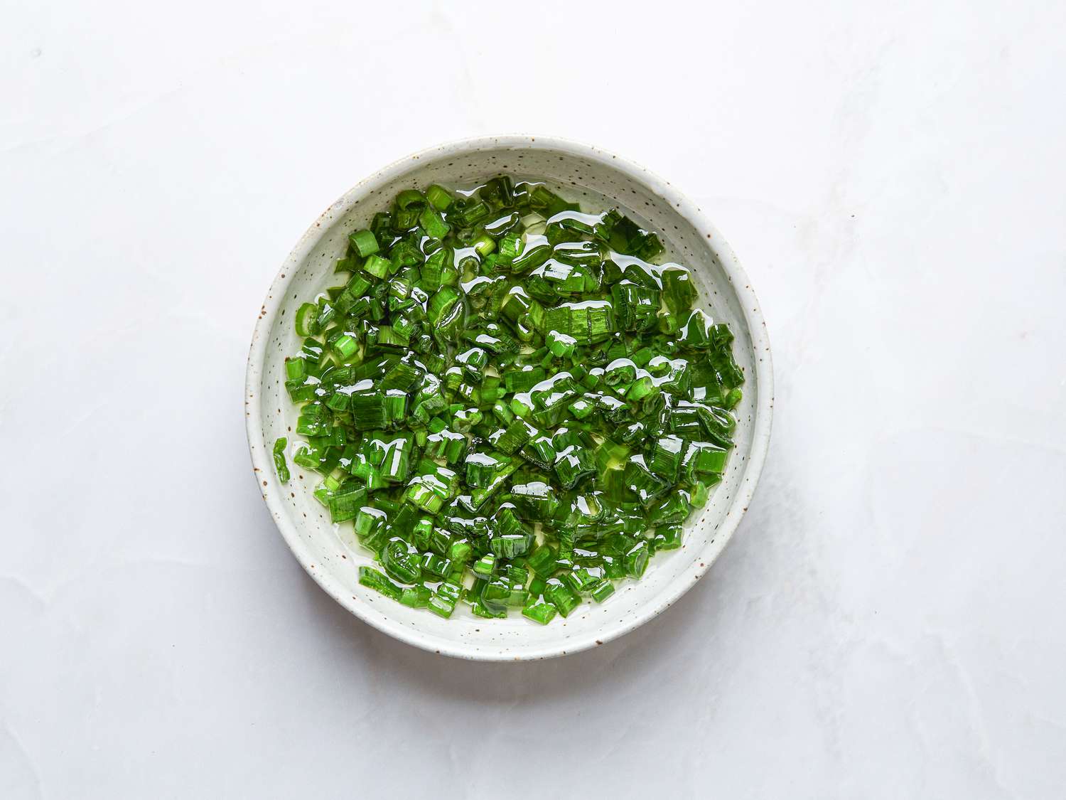 Overhead view of scallion oil