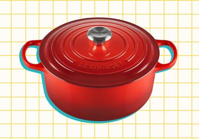 Le Creuset Enameled Cast Iron Signature Round Dutch Oven on a yellow grid background