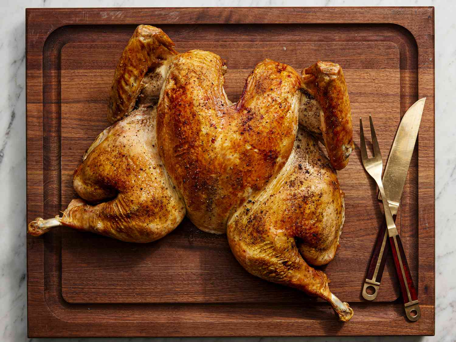 Spatchcocked turkey on a carving board