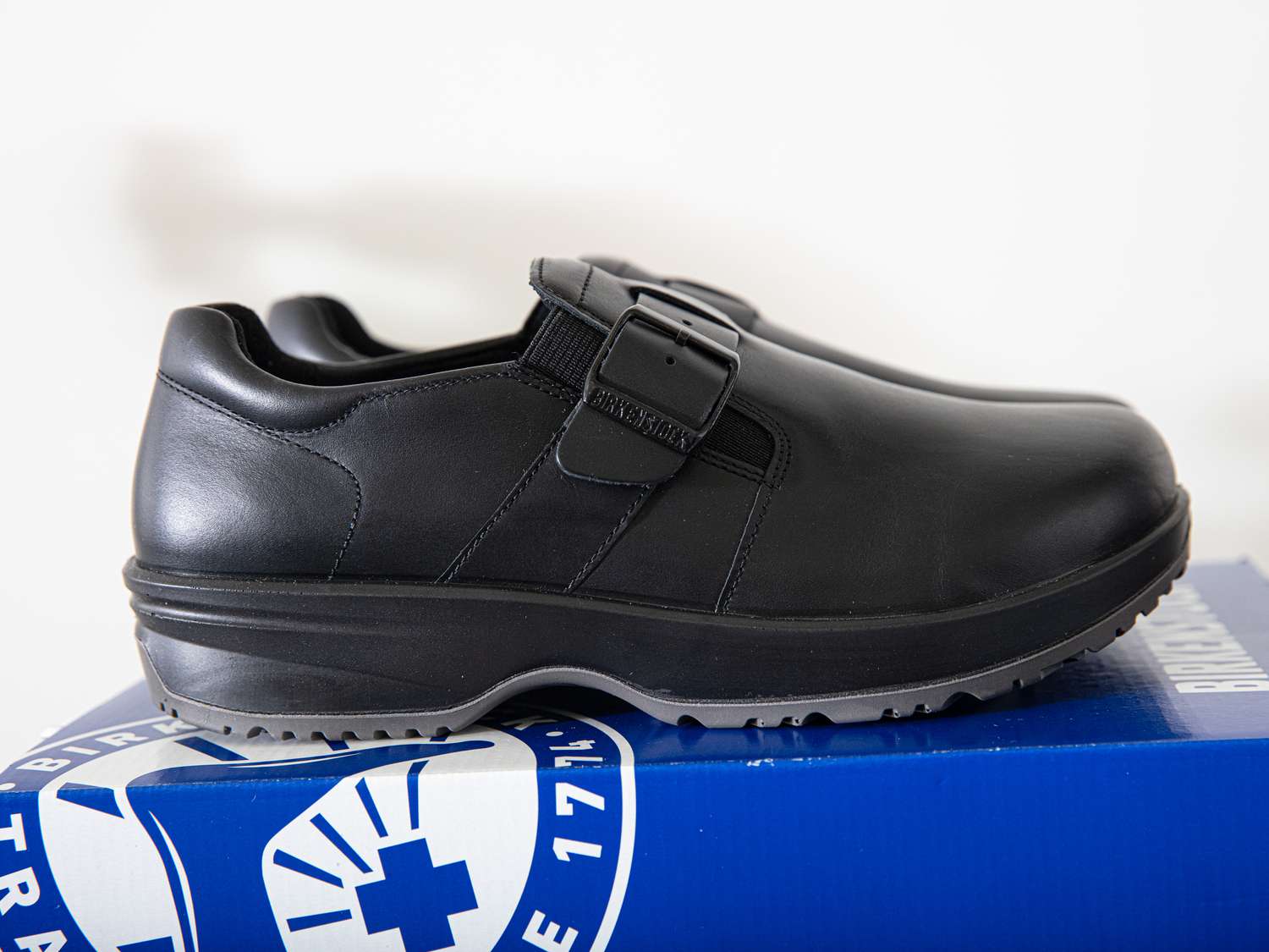 Birkenstock clogs on a shoe box.