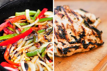 Sliced peppers and onions cooking in a cast iron skillet and a piece of grilled skinless chicken. 