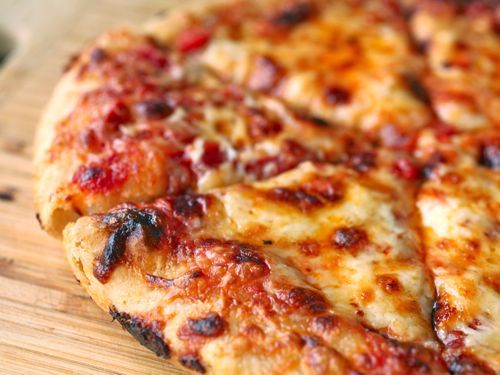 A charred and blistered pizza.