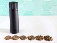 The Männkitchen Pepper Cannon behind several ground spices