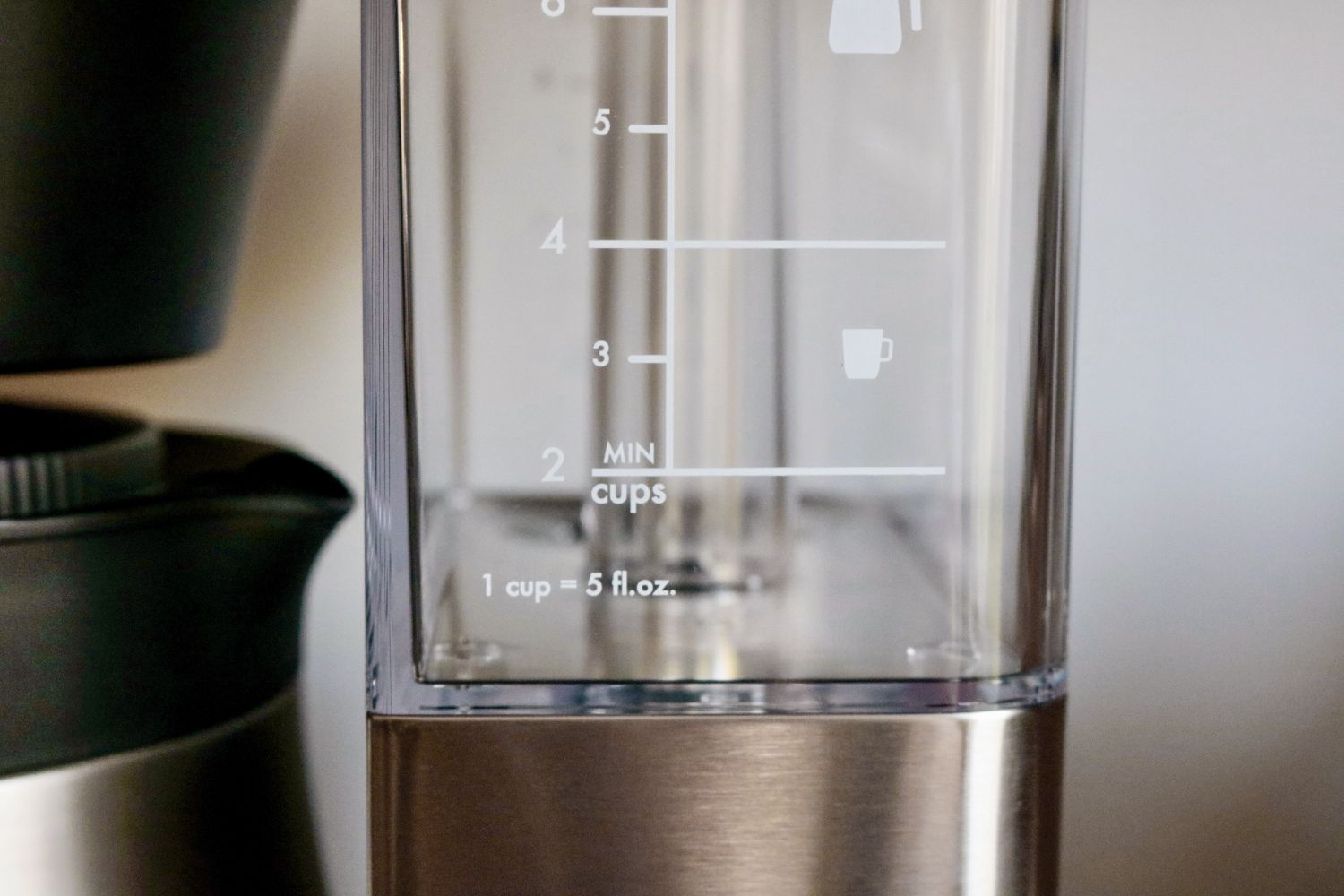 a closeup look at a coffee maker's empty water reservoir 