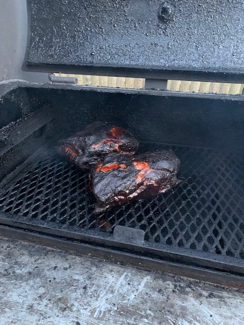 Pulled pork with very dark bark on a smoker