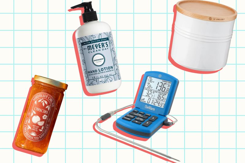 Assorted kitchen and household items including hand lotion a jar of honey a storage container and a digital cooking thermometer