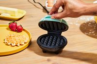 Person holding open Dash Mini Waffle Maker