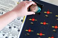 The Straightaway 12 Days of Cocktails with one door opened, with a hand pulling a cocktail can out