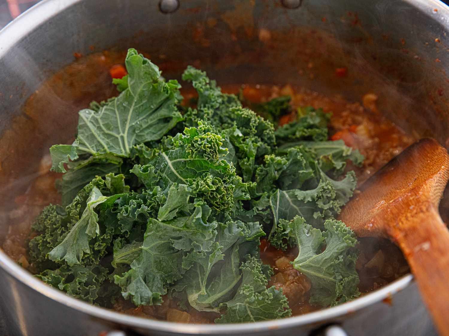 Overhead view of adding kale