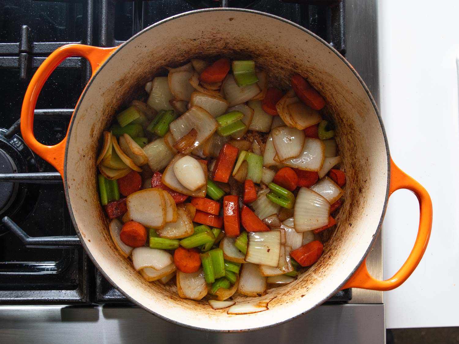 Onions, carrots, etc. are browned in Dutch oven