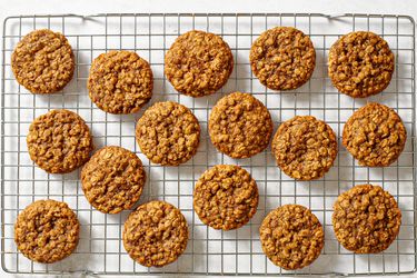 The baked maple brown sugar oatmeal cookies cooling on a wire rack.