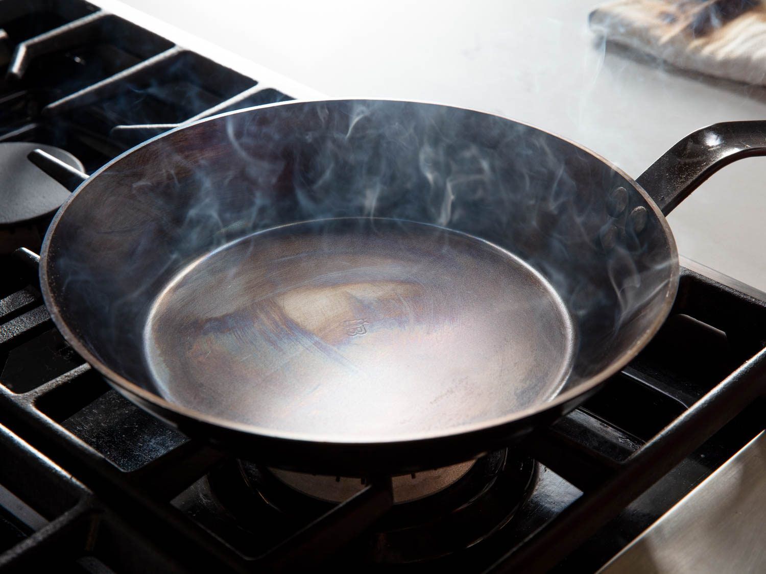 A carbon steel pan in the early stages of seasoning.