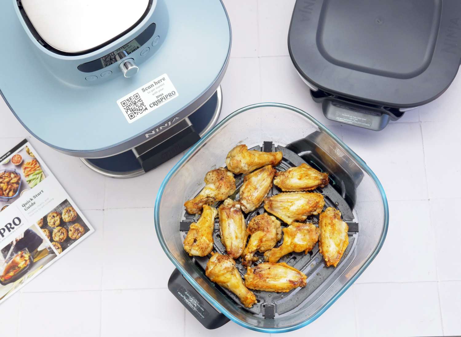 overhead view of chicken wings in the ninja crispi basket