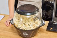 Popcorn is made in the West Bend Stir Crazy Electric Hot Oil Popcorn Popper