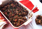 A red dish of vegan Thanksgiving stuffing.