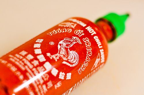 Close-up of a bottle of sriracha.