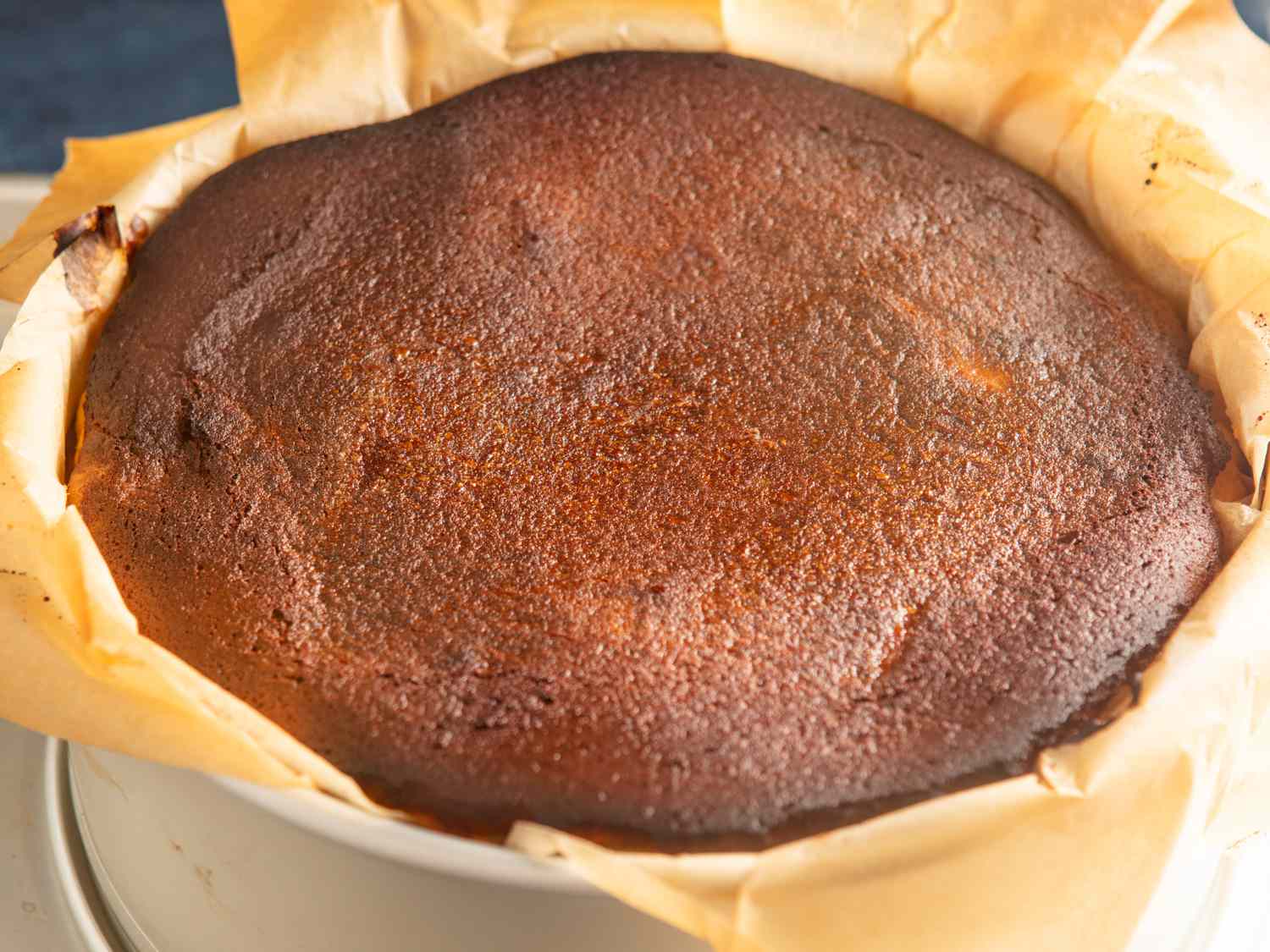 A cooked Basque cheesecake in a springform cake pan. 