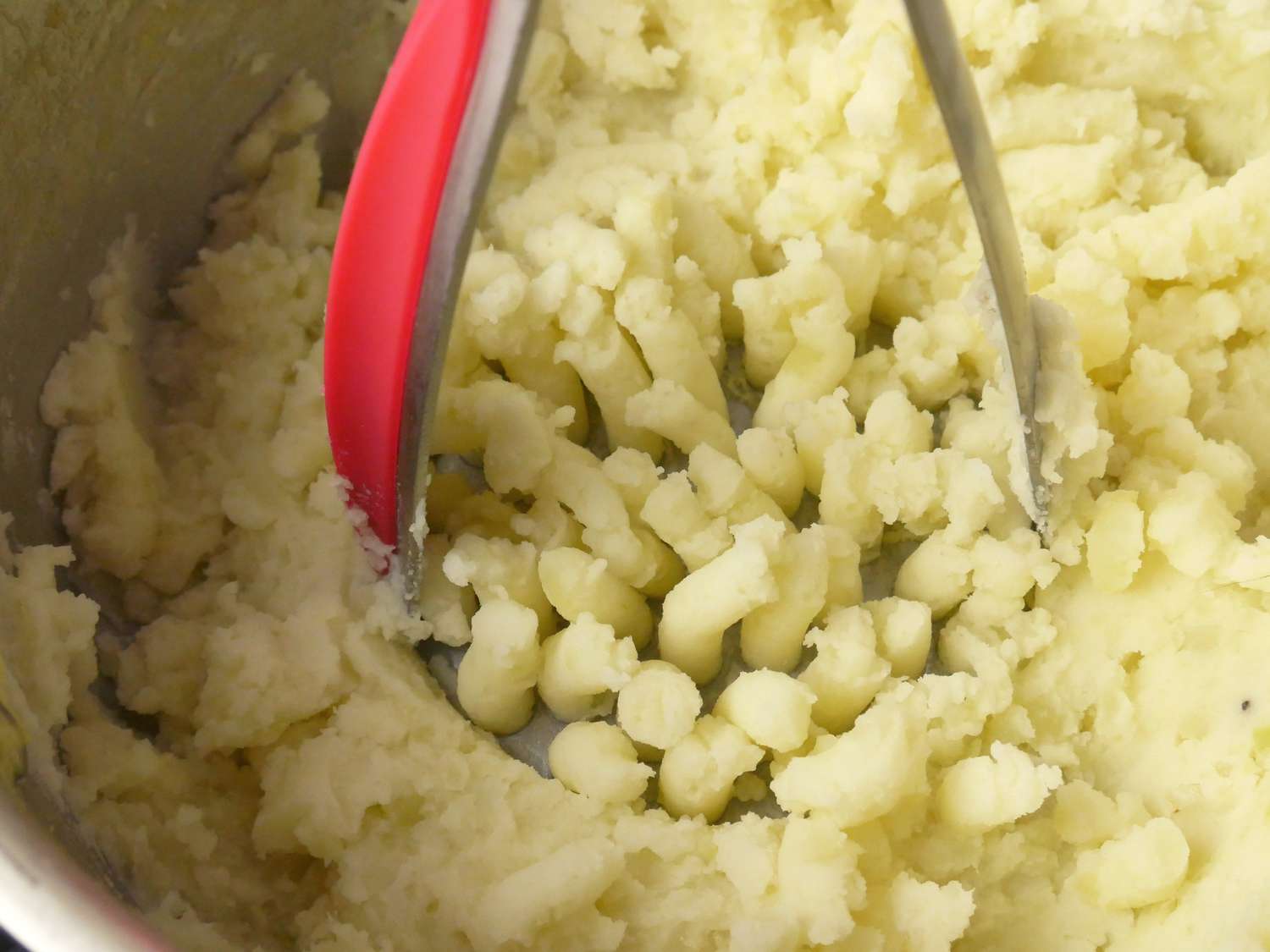 a closeup of the zyliss mashing potatoes