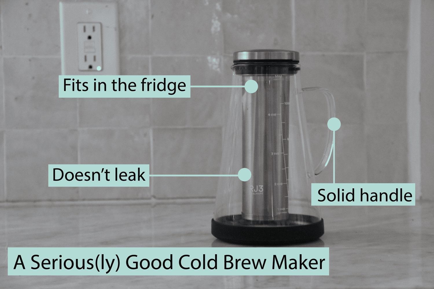 A cold brew maker on a marble countertop.