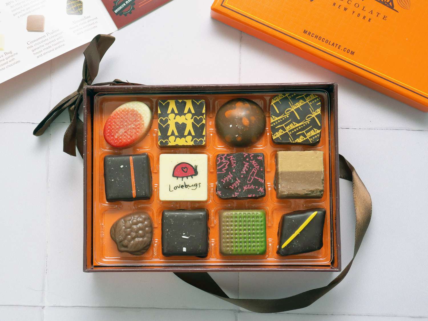 Jacques torres box of chocolates with the lid off