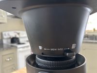 The OXO Brew 8-Cup Coffee Maker basket, showing two available sizes for brewing.