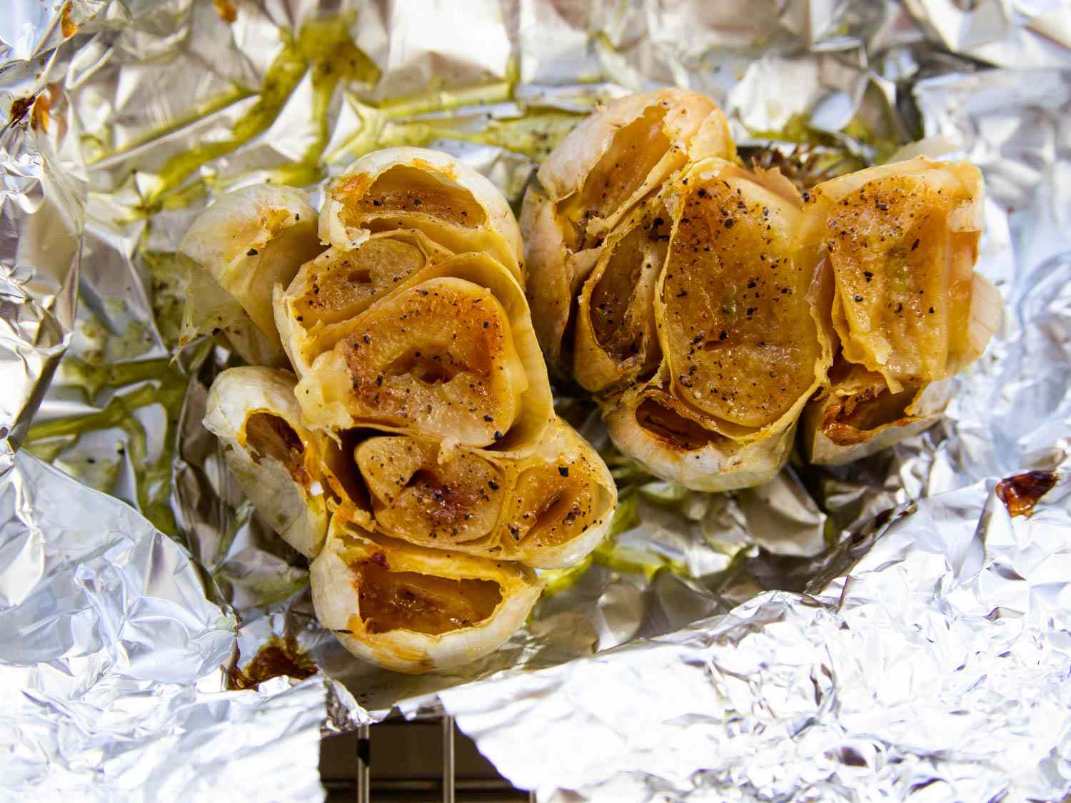 Two heads of foil-roasted garlic.