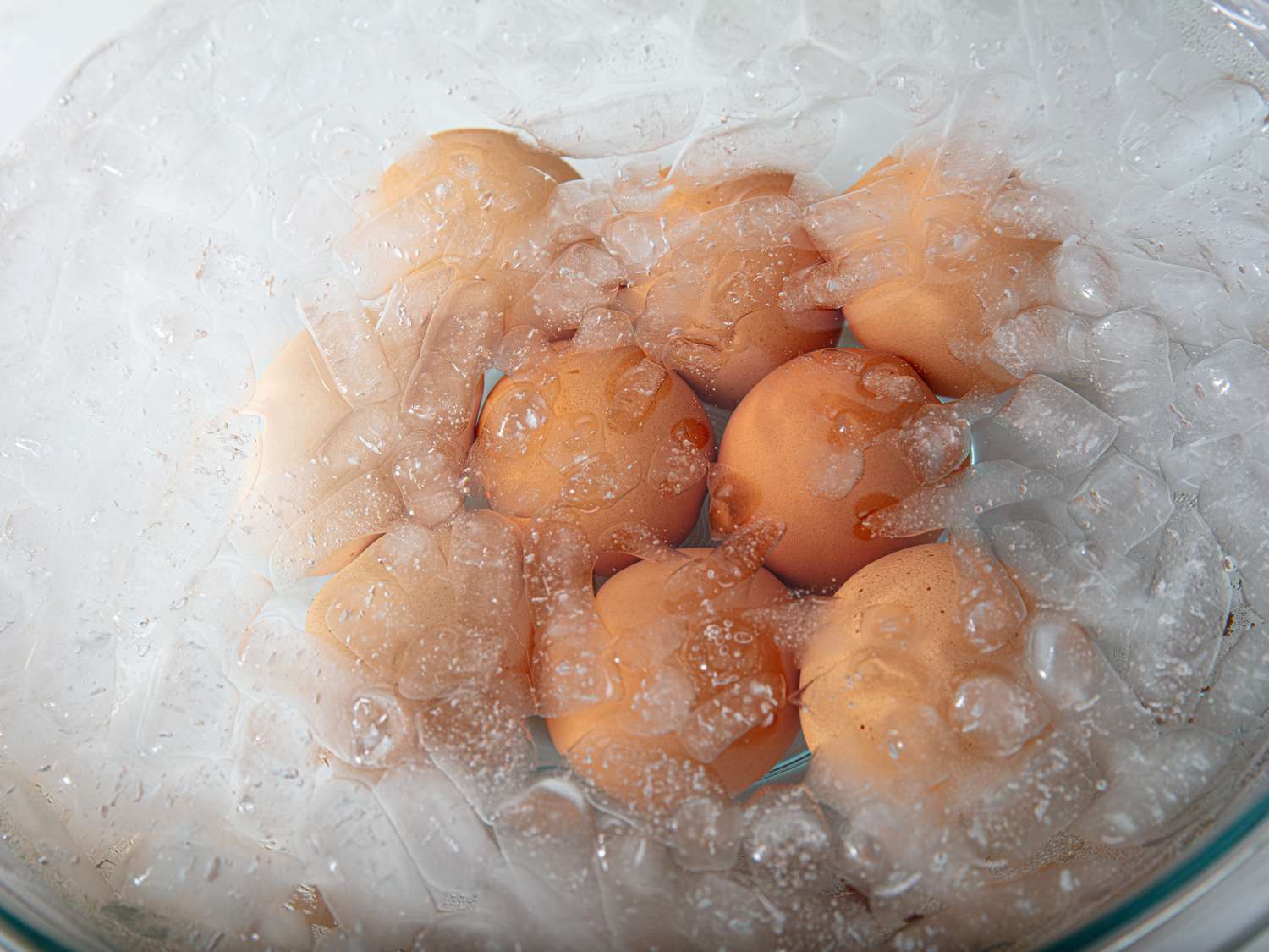 Overhead view of eggs in ice bath