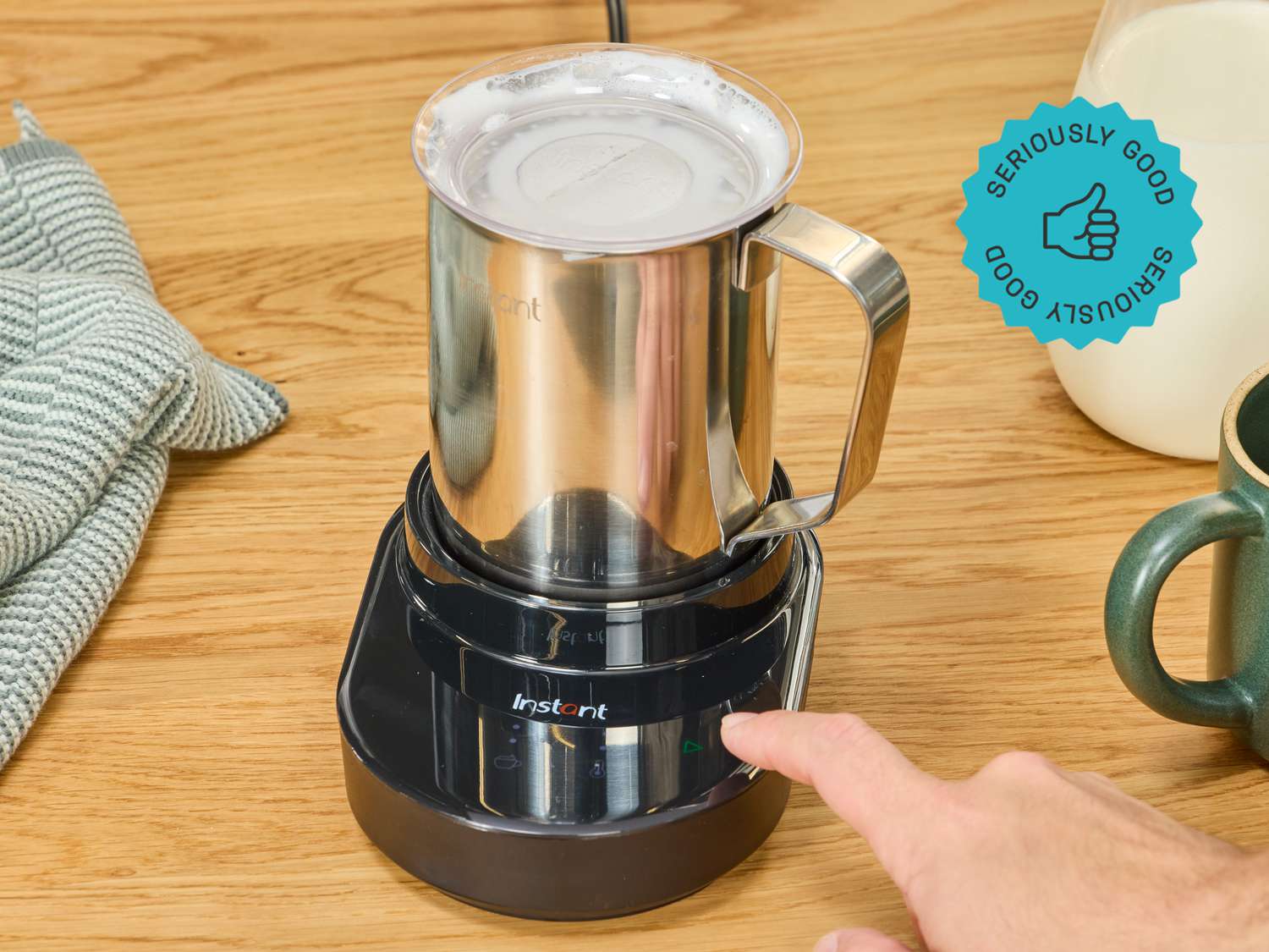 the instant pot magic frother on a wooden surface