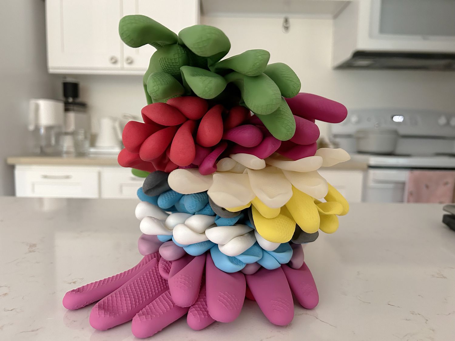 A stack of dish gloves on a countertop