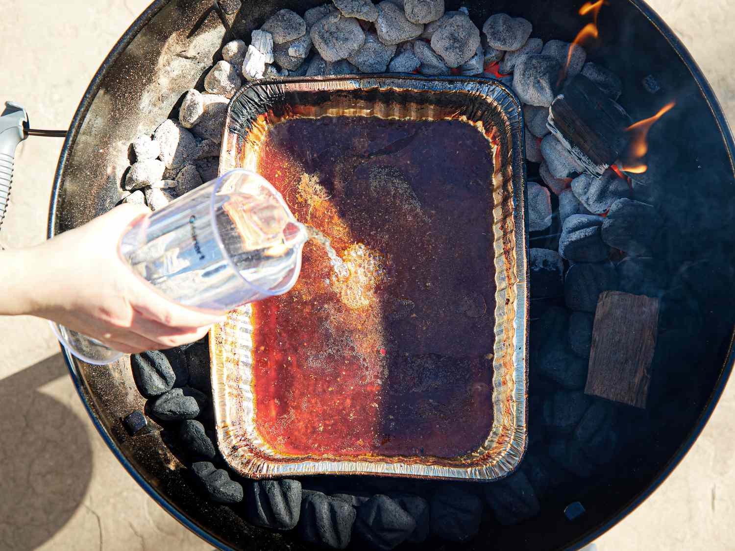 Overhead view of adding water to pan