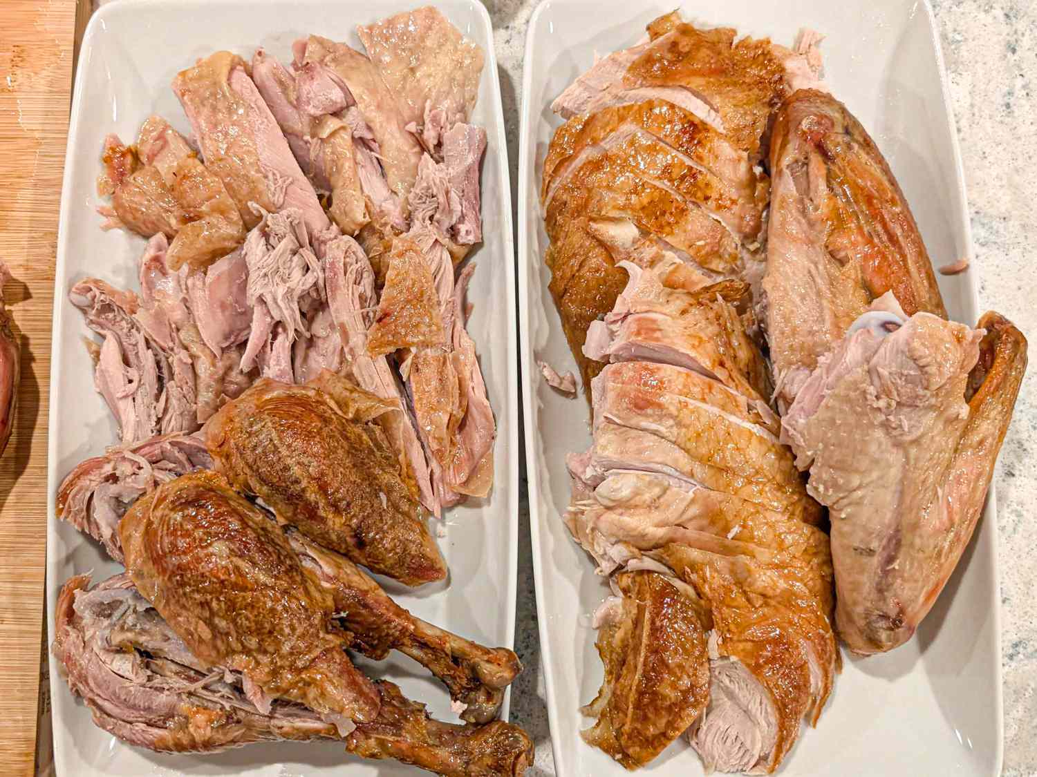 Cooked turkey meat carved and arranged on plates