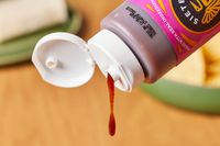 Siete Family Foods Chamoy Botana Sauce being poured