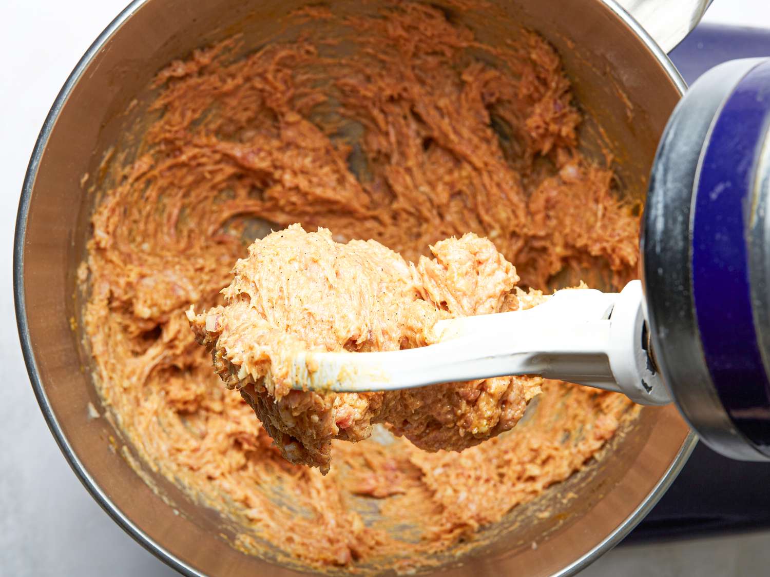 Overhead view of pork paste in stand mixer
