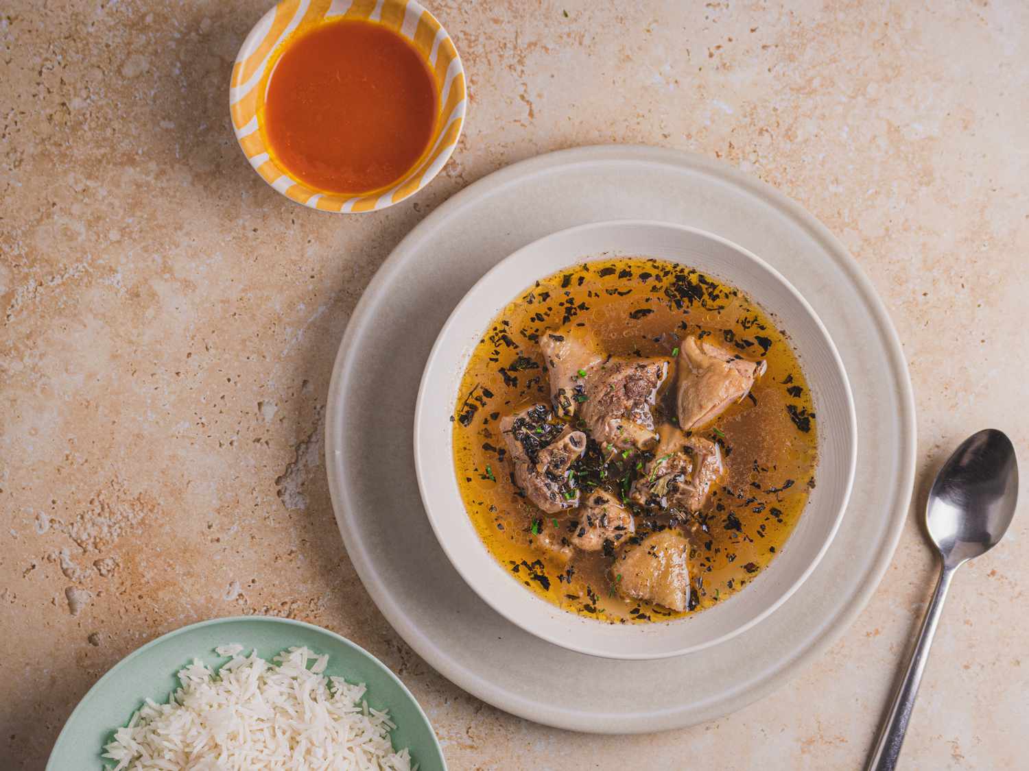 Nigerian pepper soup served with white rice. 