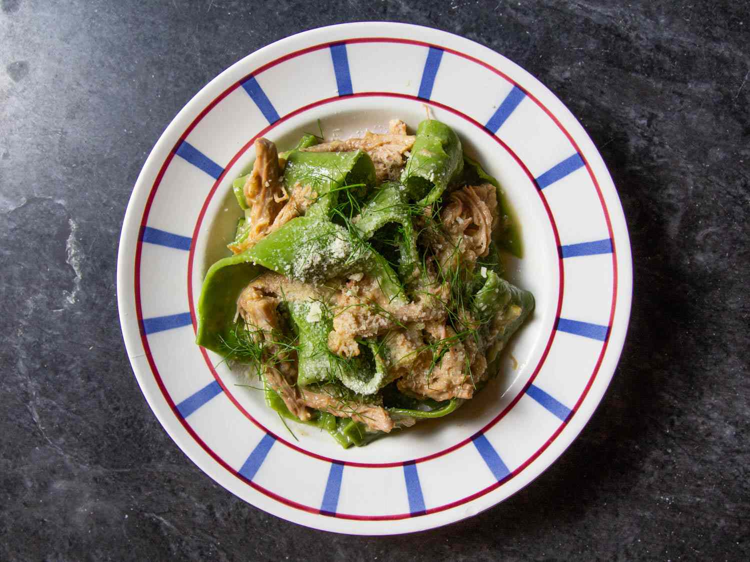 Overhead of a bowl of pappardelle with pork shoulder ragu