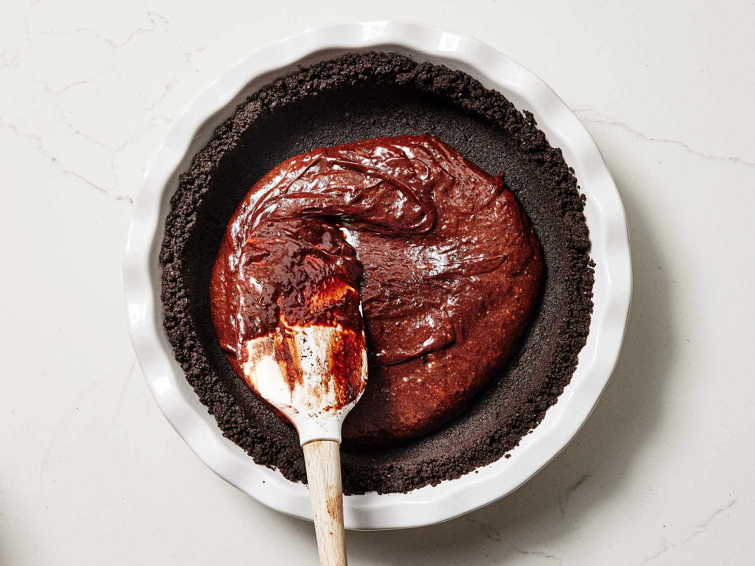 Overhead view of smoothing cake batter