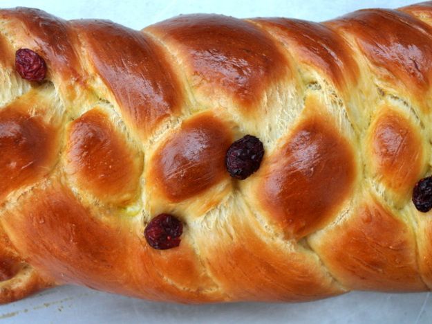 Closeup of a golden brown cranberry challah for Rosh Hashanah.