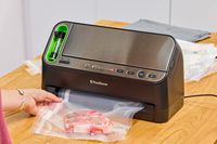 Meat is vacuumed using the FoodSaver V4400 2-in-1 Vacuum Sealer Machine