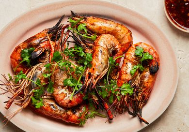 Grilled prawns with herbs and a side of sauce