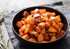 a bowl of roasted sweet potato chunks