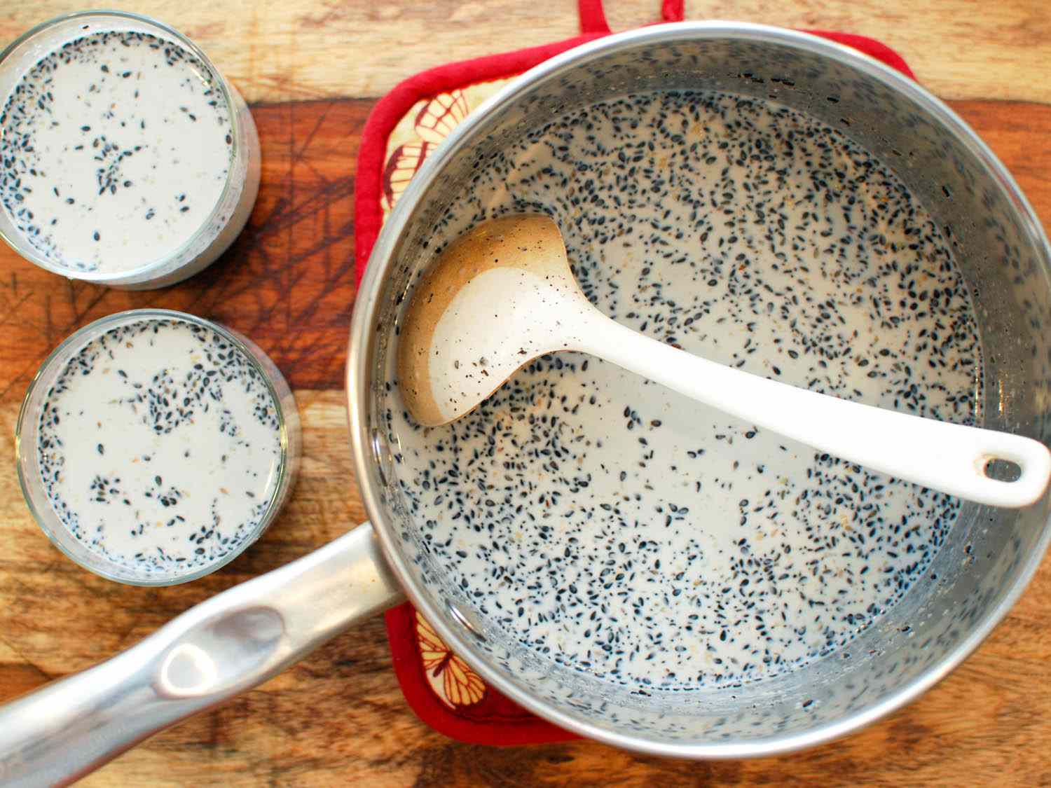 The pudding base is ladled into glasses.