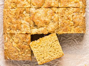 A closeup of a sliced snack cake with one piece slightly removed and placed at an angle