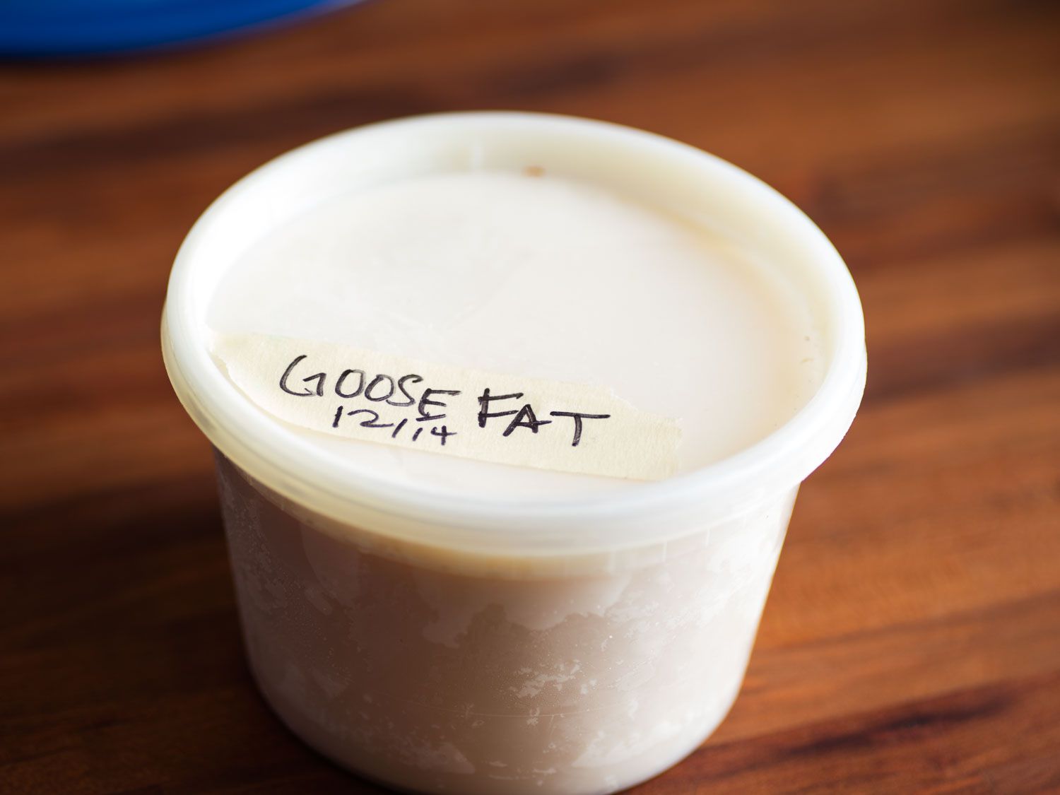 A pint-sized deli container filled with goose fat for making choucroute garnie.