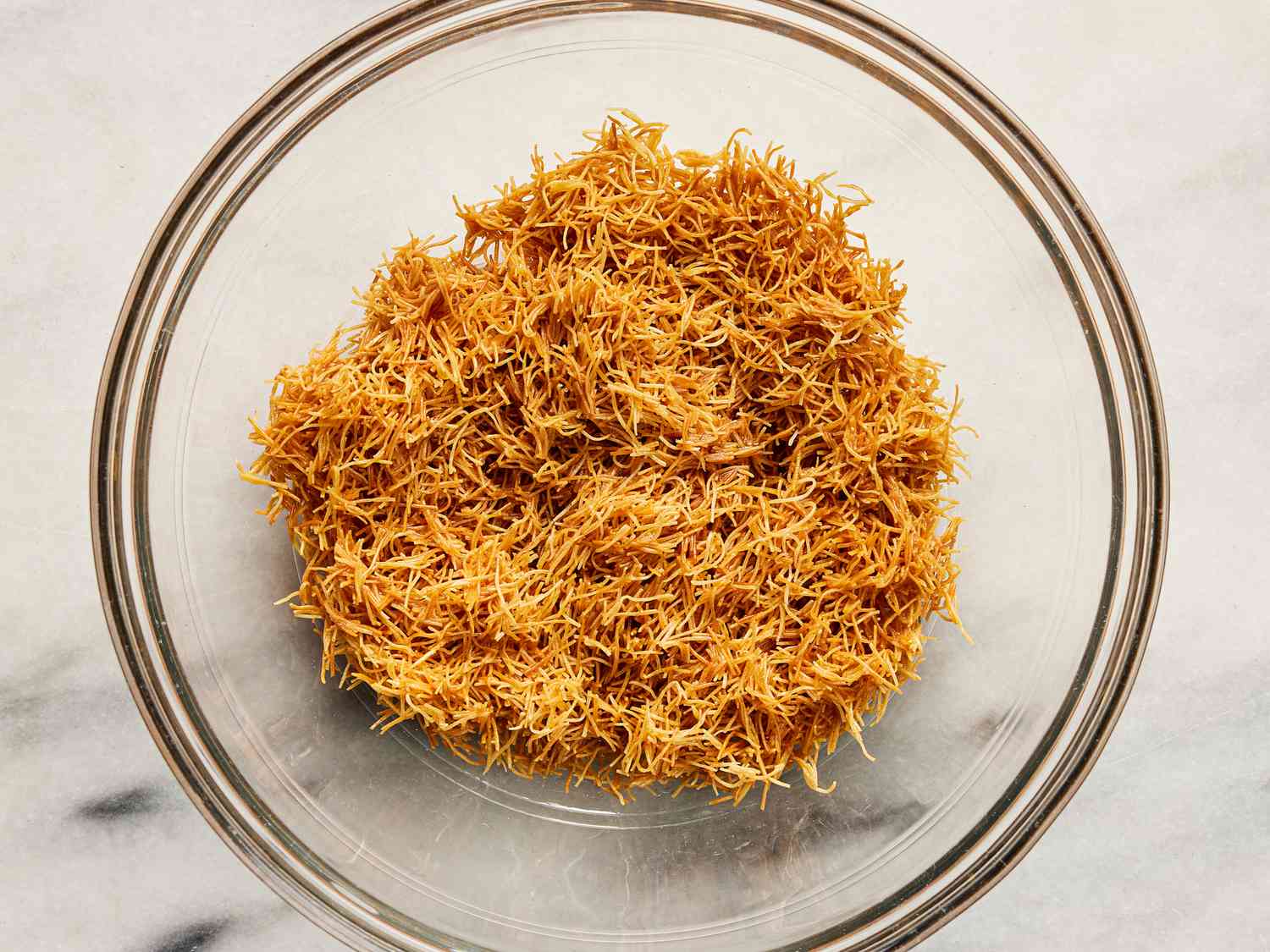 Kataifi dough in a glass bowl 