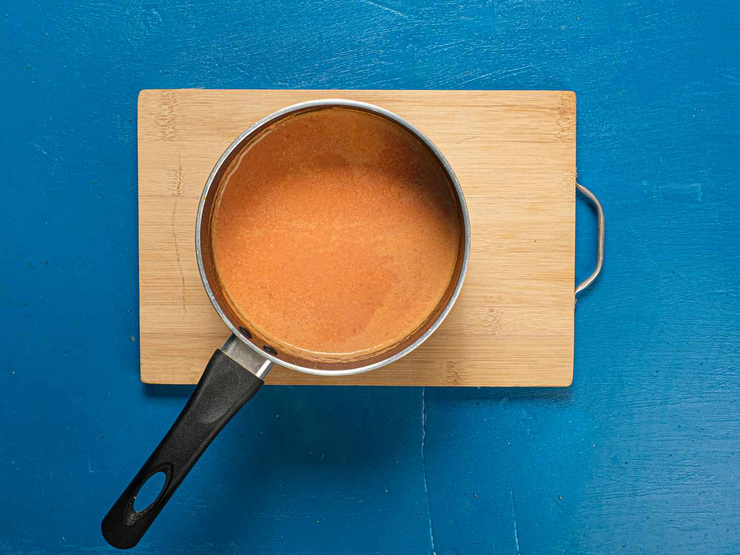 bowl taken off the heat on a wooden board